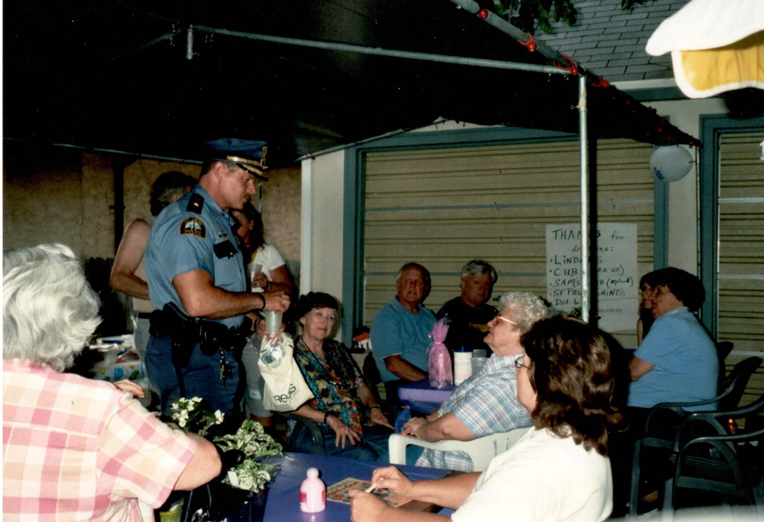 People crowd a patio at an undated National Night Out event.