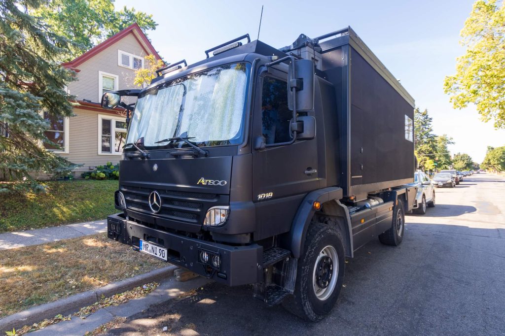 3 quarters view of the RV with shades in the front window