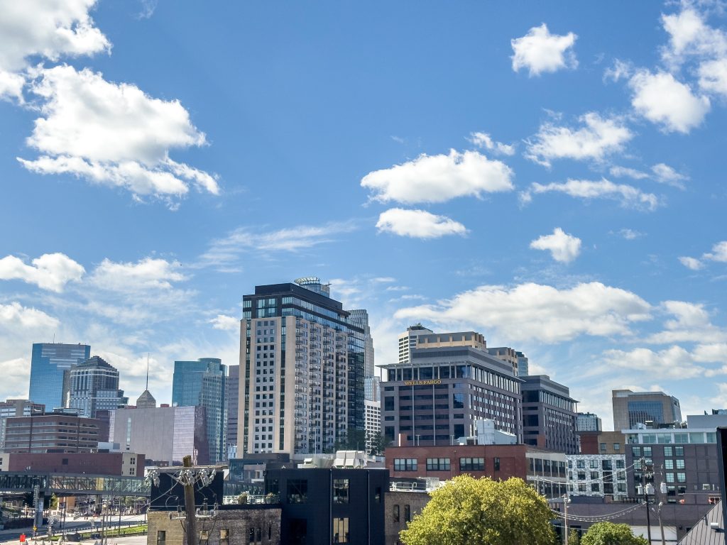 Blue skies and the Minneapolis Downtown skyline from Open Book in Downtown East.