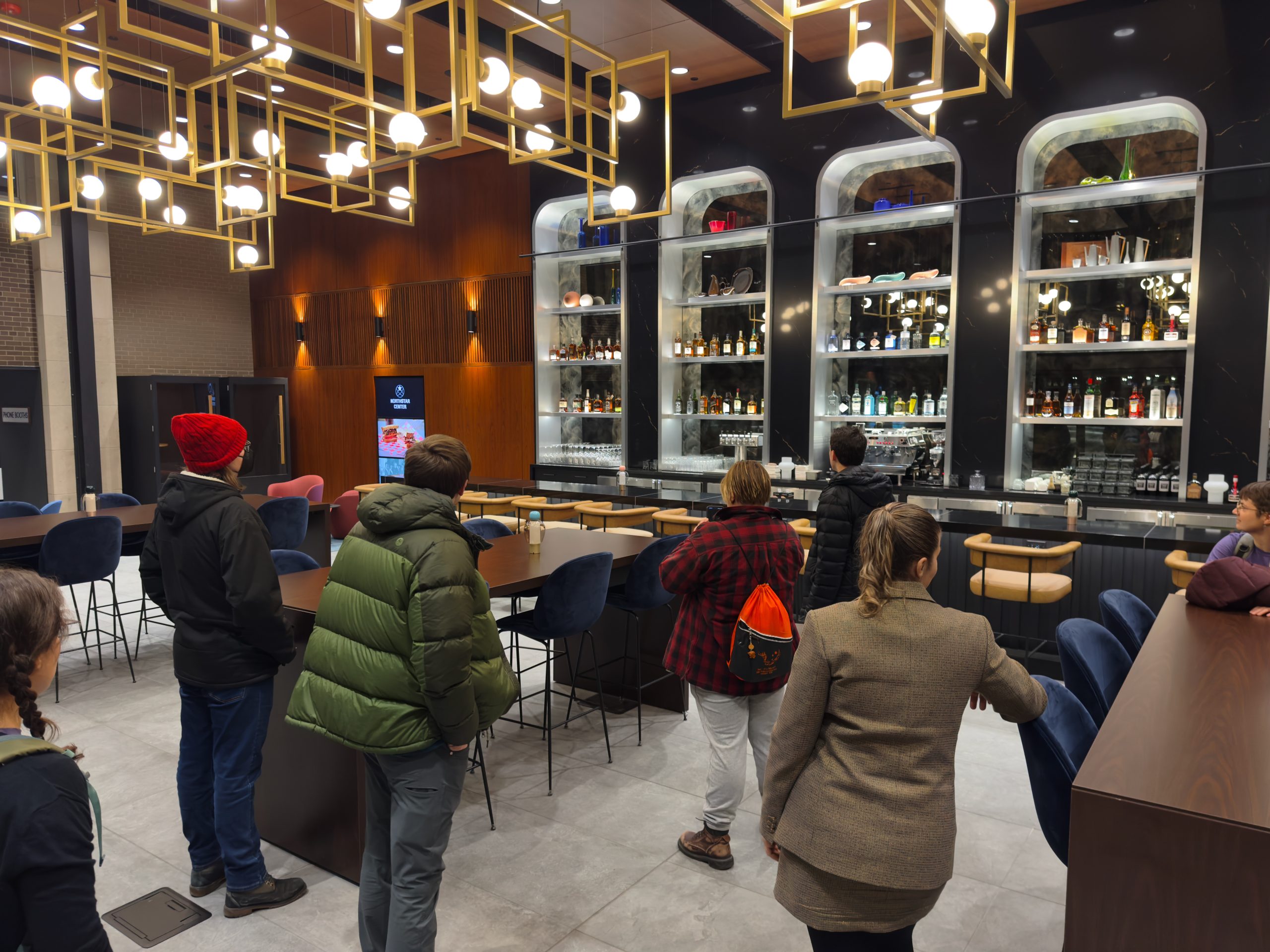 A tour group visits the Northstar Center bar and dining area party room that is available for rent on January 16, 2025