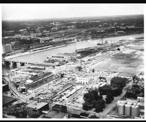 An aerial view of industrial development and highways along the Mississippi River. 