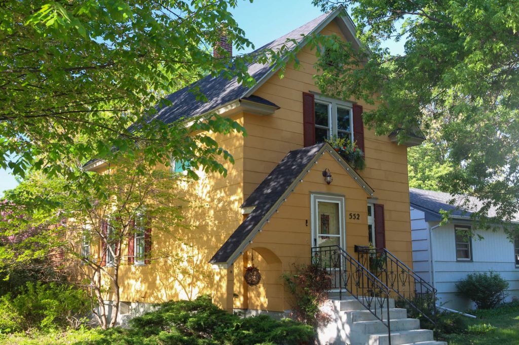A two-level apricot-colored house on Michigan Street.