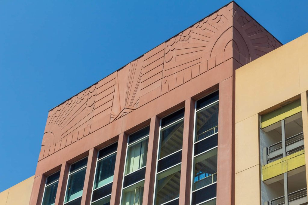 A vaguely Art-Deco relief atop of a parking ramp.