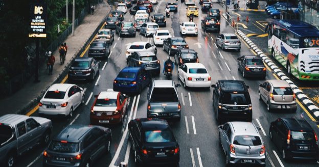 A street filled with car traffic. From Rumman Amin on Unsplash.