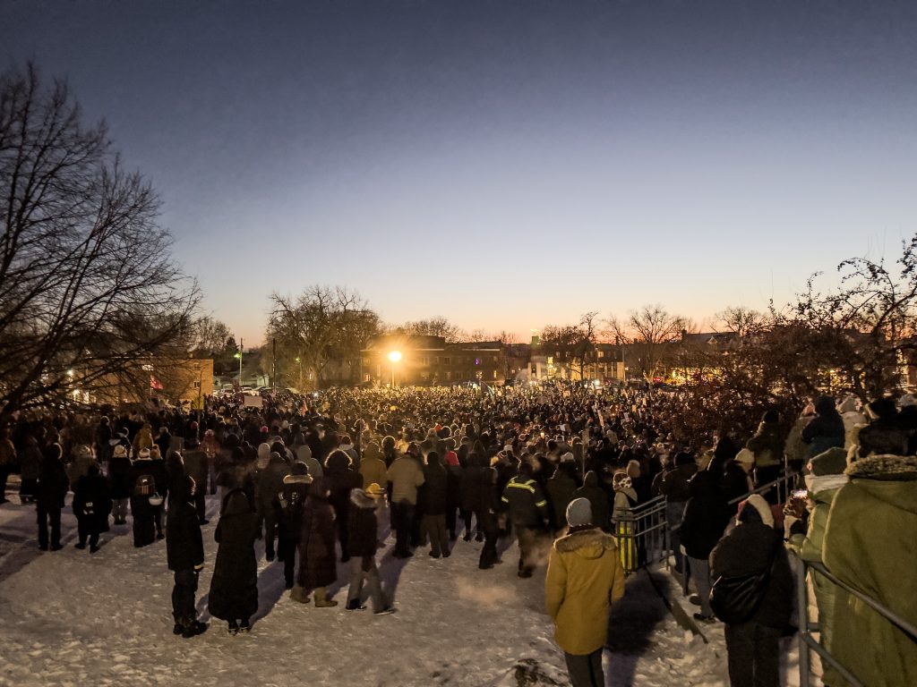 Thousands gather in Whittier Park in Minneapolis for a memorial vigil to honor Alex Pretti