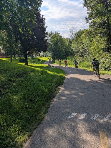 People biking on a bike path.