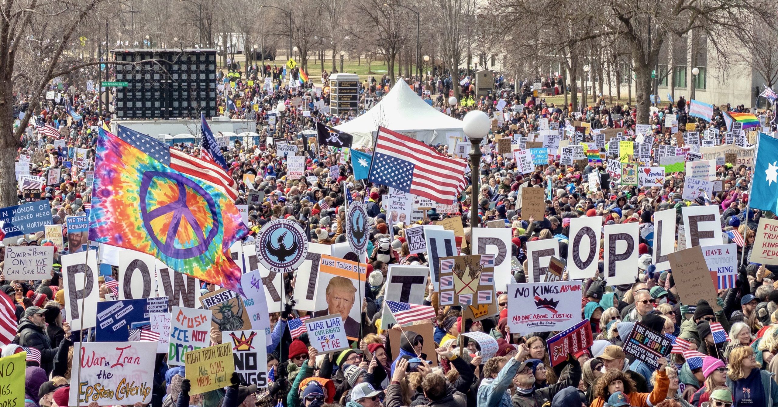 Demonstrators at No Kings 3 in St. Paul, Minnesota at the Minnesota State Capitol on Saturday, March 28, 2026. A series of hand-held signs reads, "Power to the People."