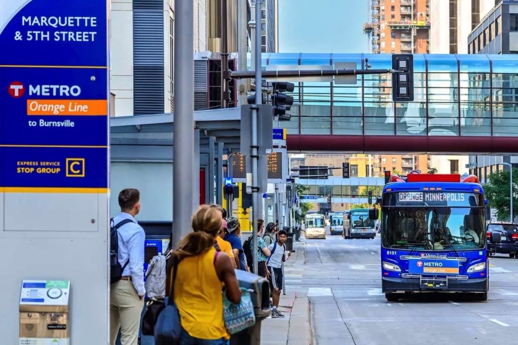Metro Transit METRO Orange Line bus rapid transit arrives at an upgraded stop on Marquette Avenue in Downtown Minneapolis