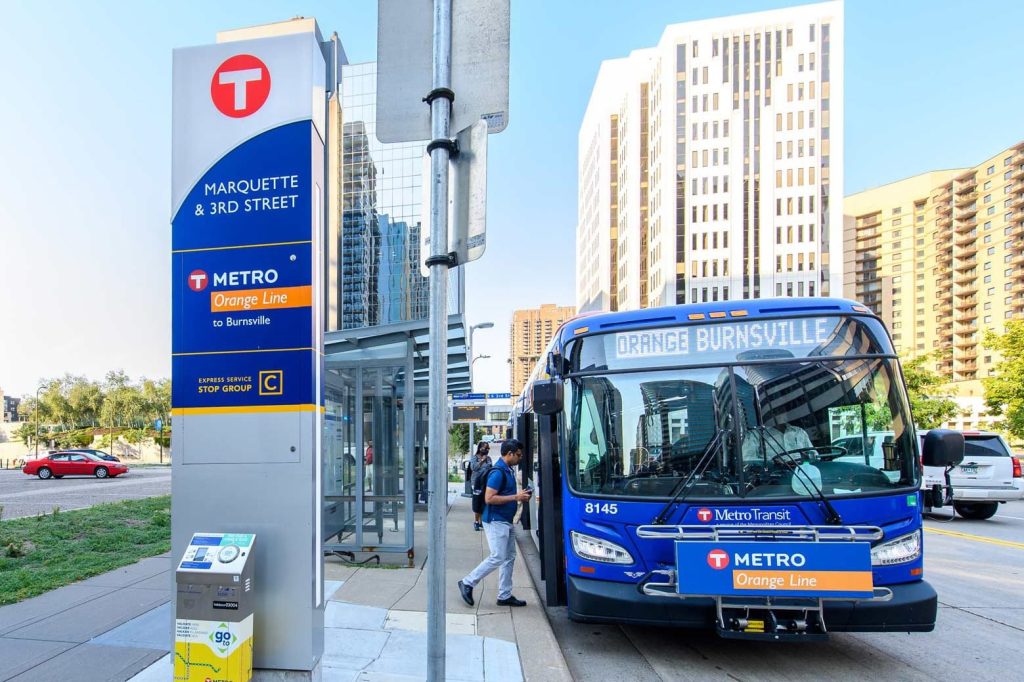 Metro Transit METRO Orange Line bus rapid transit arrives at the upgraded stop at Marquette Avenue and 3rd Street in Downtown Minneapolis
