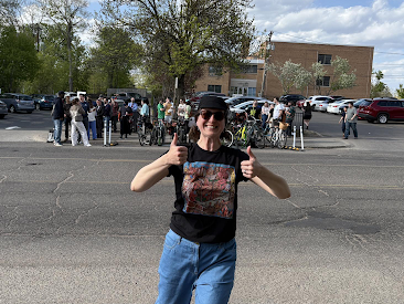 Photo of Sarah Johnson with thumbs  up at the official unveiling of the Grand Ave bike racks.  