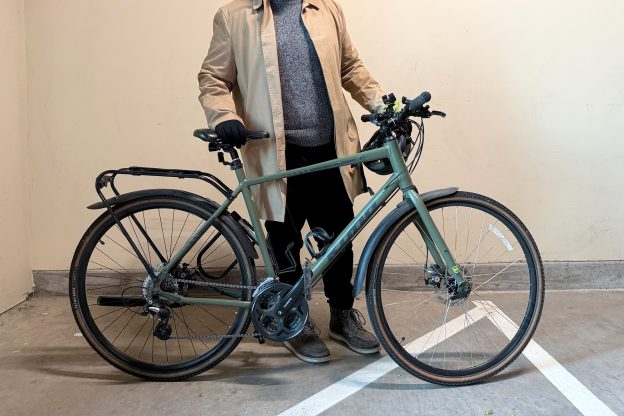 Derek shows off his commuting bicycle.