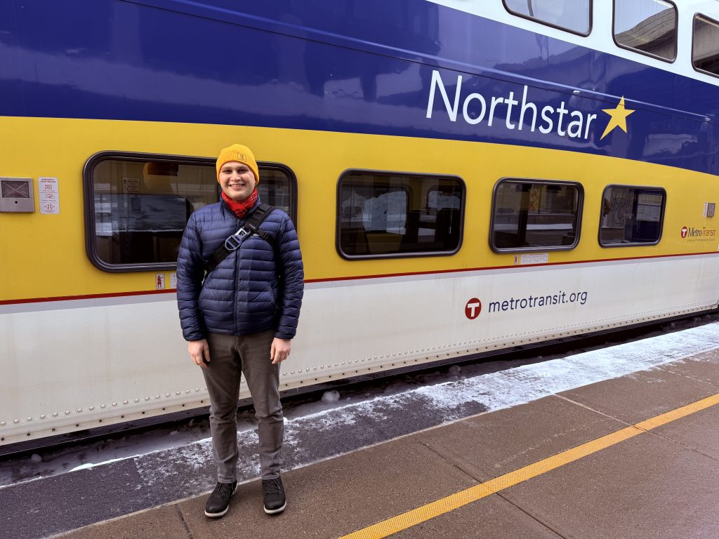 Brian Mitchell standing in front of a Northstar train