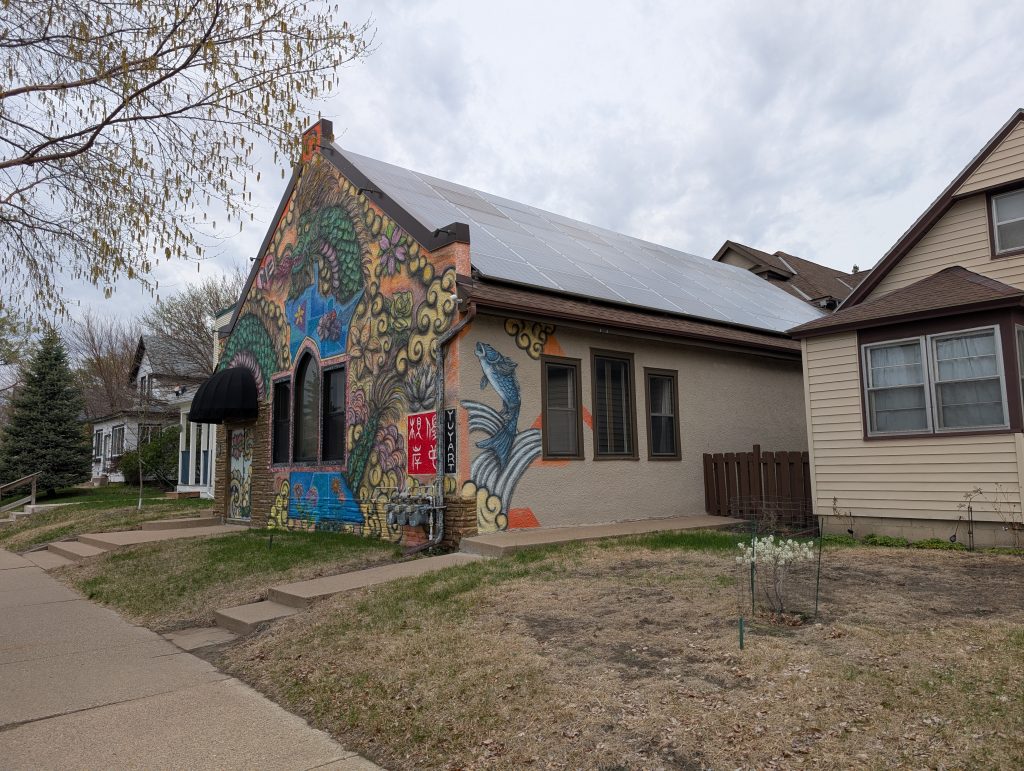 house with mural on front and side
