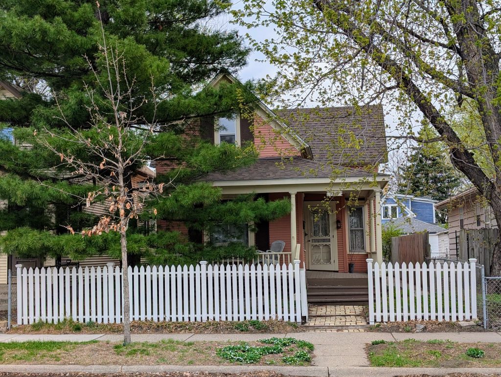 one-and-a-half story cross-gable house with front porch