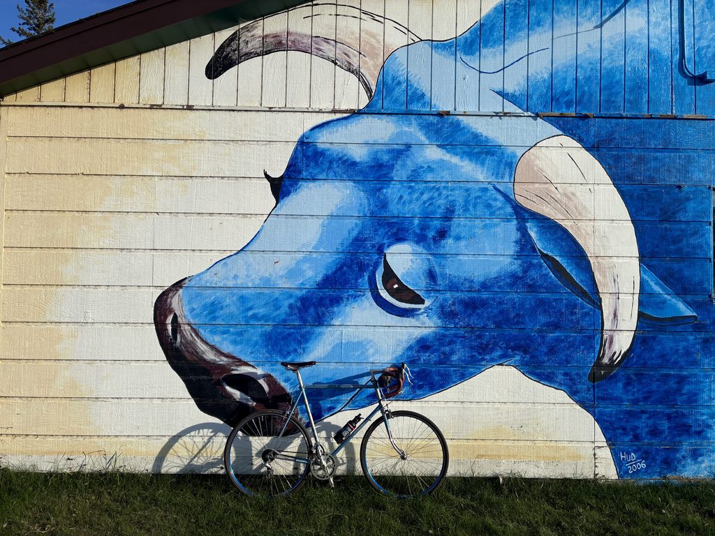 A mural of a weary Babe the Blue Ox in downtown Akeley.