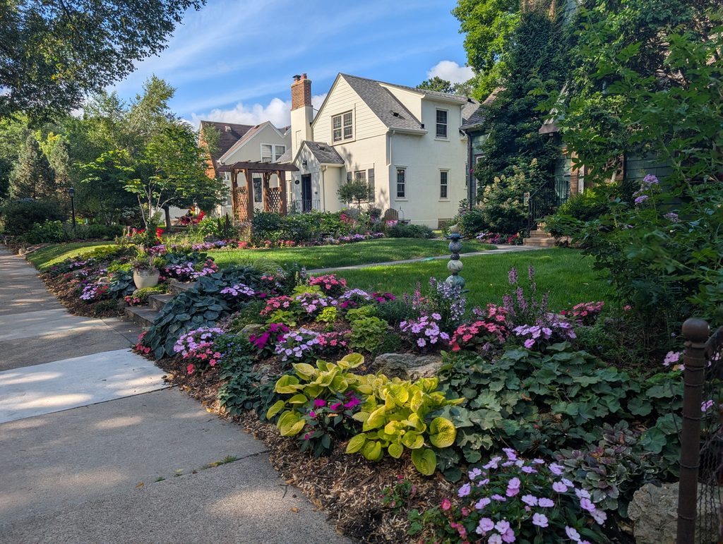 front lawns with gardening along sidewalk