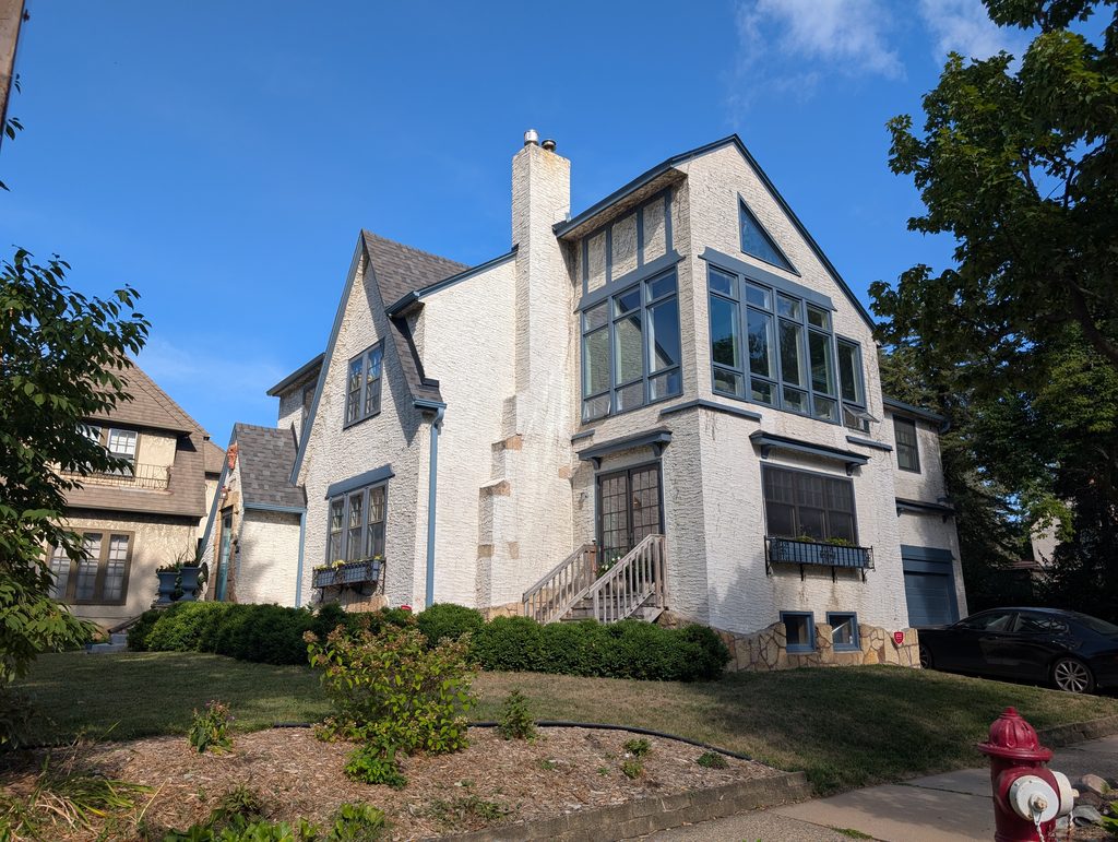 stucco house with addition
