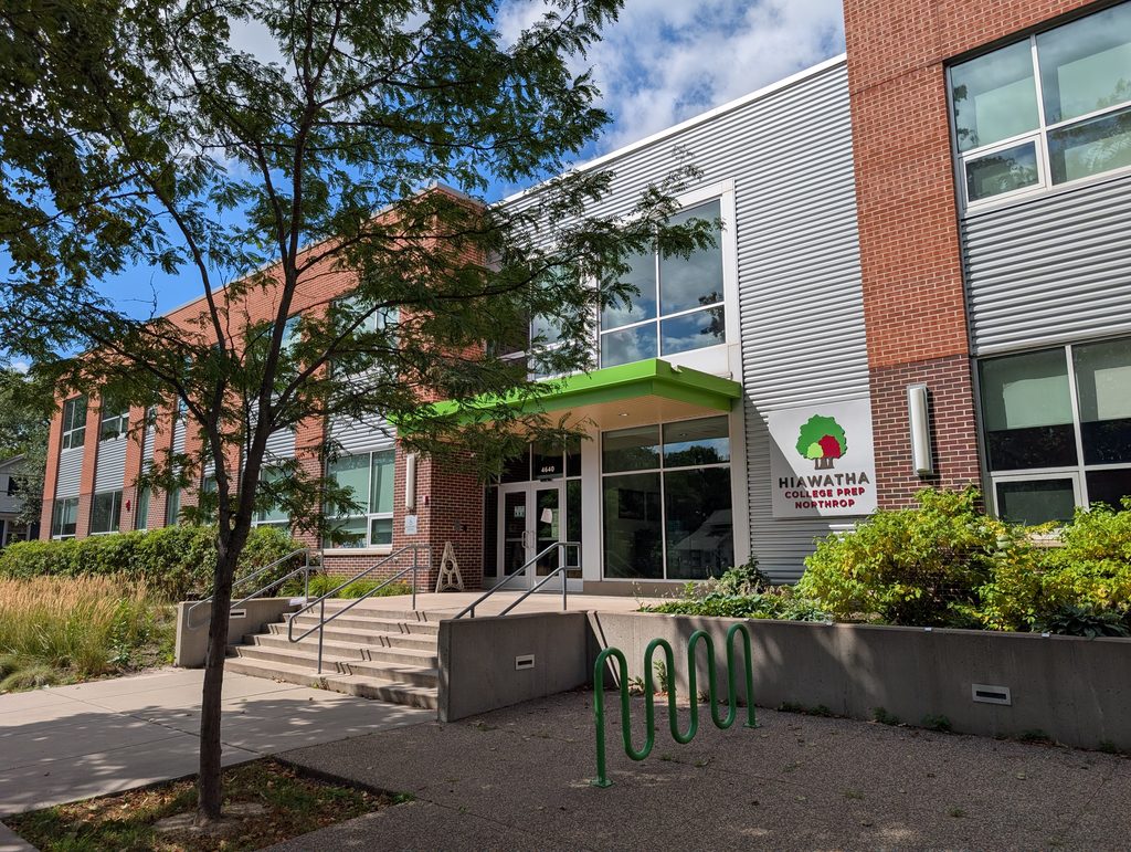 21st-century school building signed as Hiawatha College Prep Northrop