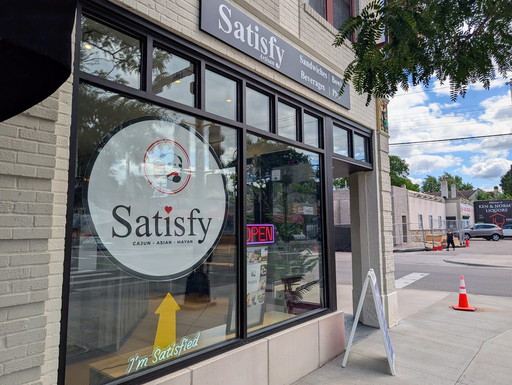 shop window signed "Satisfy"