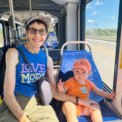 Amy and grandson on the bus.